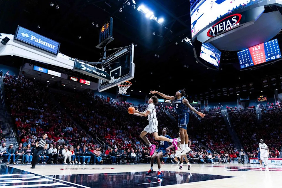 San Diego State guard Miles Byrd (21) attempts a layup during an NCAA Basketball game between Utah State and San Diego State, Wednesday February 25, 2026 at Viejas Arena in San Diego, Calif.