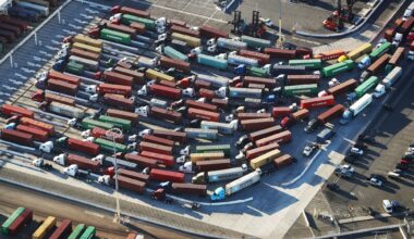 An aerial view of shipping containers attached to trucks
