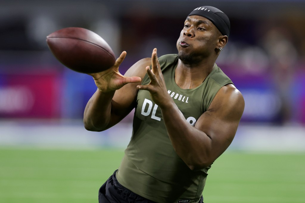 Defensive lineman Keion White of Georgia Tech catches a football at the NFL Combine.