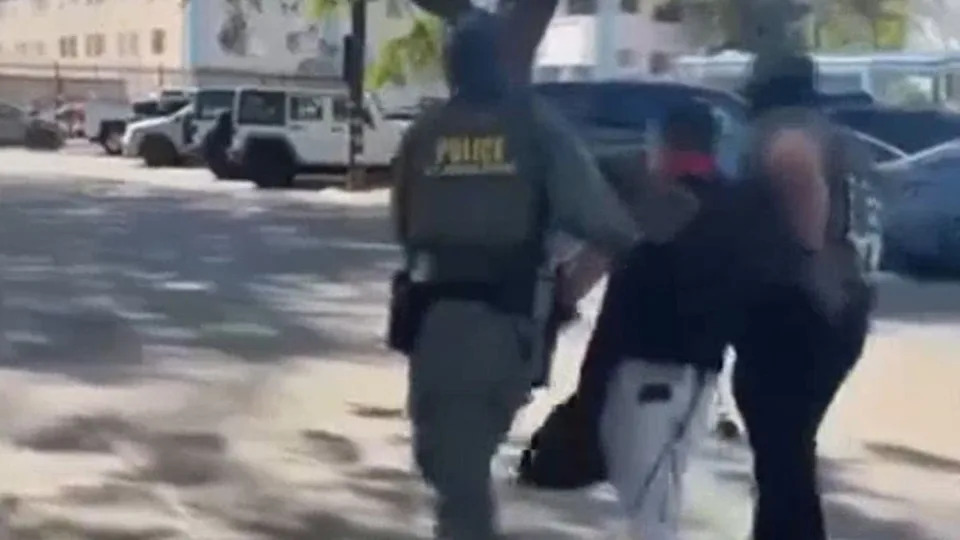 Two agents can be seen in the footage walking off with Chavez (North Hills United Methodist Church)