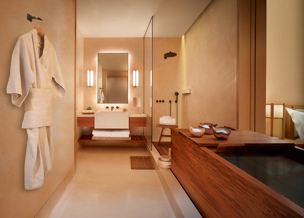 Nobu Hotel Palo Alto Modern bathroom with a wooden soaking tub and minimalistic design elements.