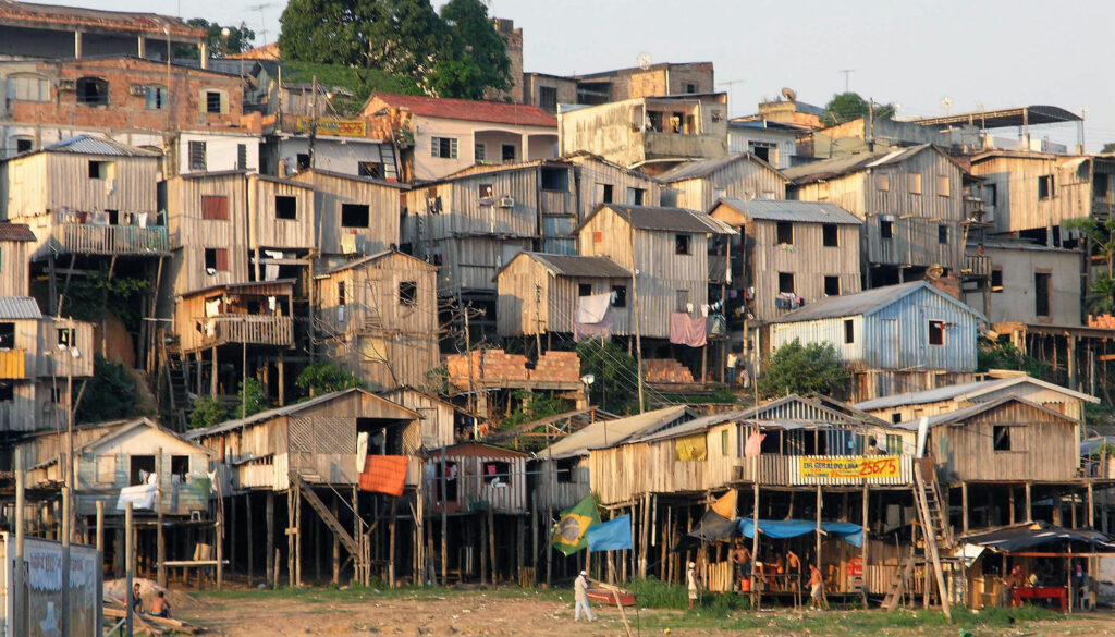 A community of roughly two-dozen simple wooden homes form a favela in Manaus, Brazil