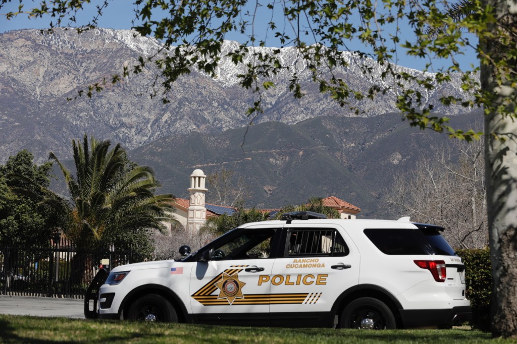 A Rancho Cucamonga police cruiser parked outside the Islamic Center of Inland Empire with mountains in the background, providing security after the Christchurch mosque shootings.