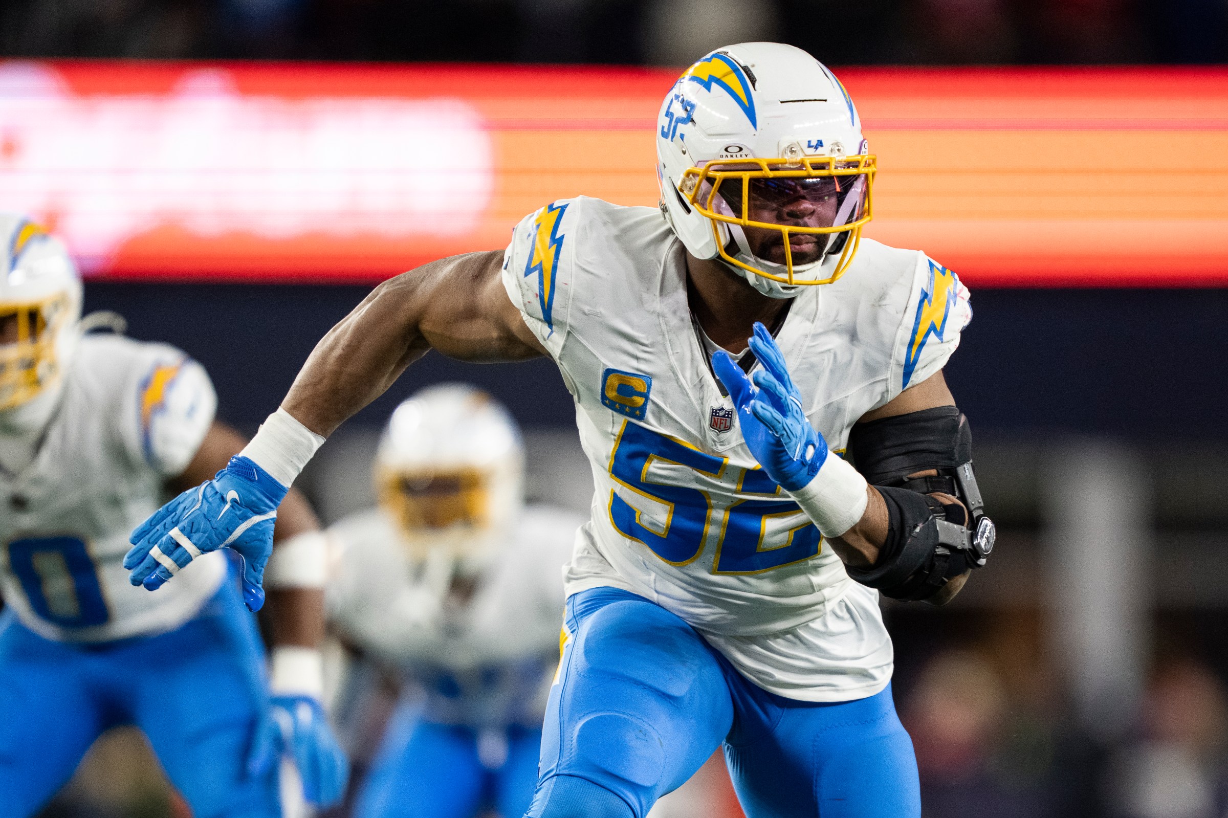 FOXBOROUGH, MASSACHUSETTS - JANUARY 11: Khalil Mack #52 of the Los Angeles Chargers runs around the edge during an NFL wild card playoff game against the New England Patriots at Gillette Stadium on January 11, 2026 in Foxborough, Massachusetts. (Photo by Michael Owens/Getty Images)