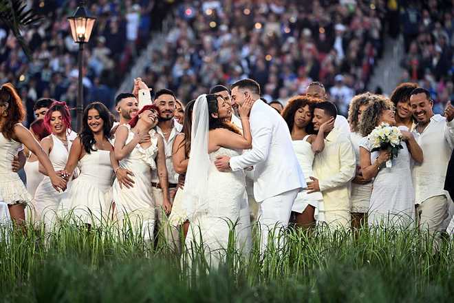 Performers portray a wedding during Puerto Rican singer Bad Bunny performance at Super Bowl LX Patriots vs Seahawks Apple Music Halftime Show at Levi's Stadium in Santa Clara, California on February 8, 2026. (Photo by JOSH EDELSON / AFP via Getty Images)