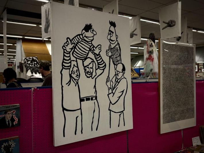 black and white artwork of three men puppeteering