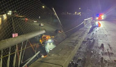 The damaged guardrail is shown on the Martin Luther King Jr. Boulevard overpass above Highway 99 in Sacramento on Thursday, Feb. 19, 2026, after a driver crashed through the barrier and plunged onto the freeway below. The driver was arrested on suspicion of driving under the influence after the crash, which caused minor injuries and traffic delays as crews cleared debris and repaired about 40 feet of railing.