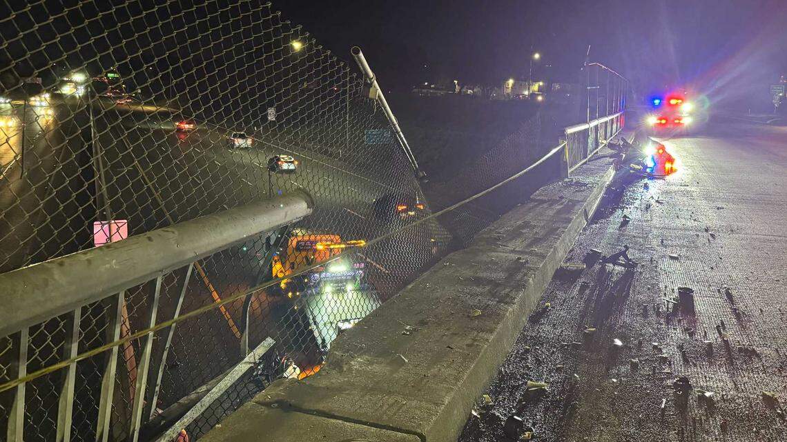 The damaged guardrail is shown on the Martin Luther King Jr. Boulevard overpass above Highway 99 in Sacramento on Thursday, Feb. 19, 2026, after a driver crashed through the barrier and plunged onto the freeway below. The driver was arrested on suspicion of driving under the influence after the crash, which caused minor injuries and traffic delays as crews cleared debris and repaired about 40 feet of railing.