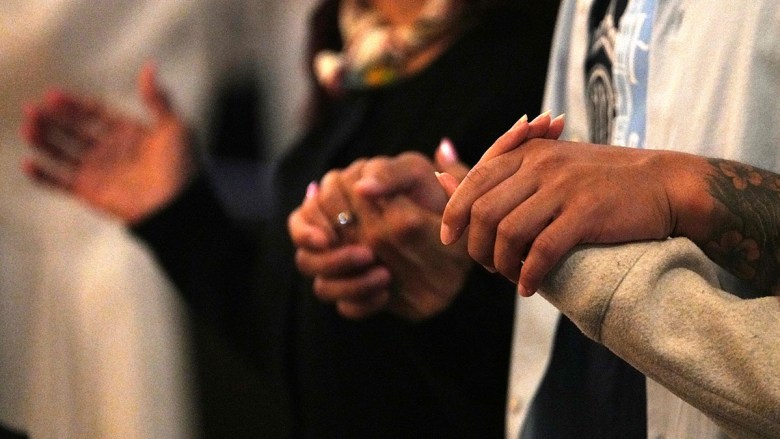 People pray at St Joseph Cathedral in downtown San Diego. (Photo by Chris Stone/Times of San Diego)