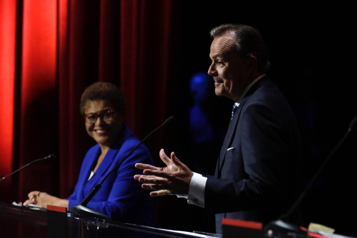 U.S. Rep. Karen Bass, left, and businessman Rick Caruso, right, during the mayoral debate at Bovard Auditorium on the USC campus on March 22, 2022. (Genaro Molina / Los Angeles Times via Getty Images)
