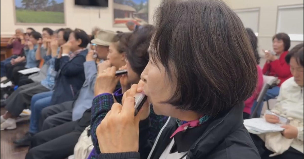Koreatown seniors win over hockey fans with harmonica performances at LA Kings games
