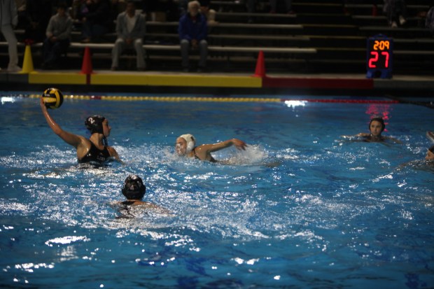 La Jolla High School junior Avery Edstrom (No. 2 in black cap) lines up a shot during the CIF San Diego Section Open Division quarterfinals Feb. 11 against Torrey Pines. (Ashley Mackin-Solomon)
