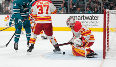 Wolf makes 34 saves, Flames defeat Sharks