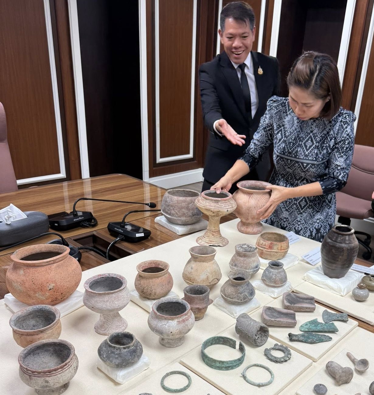 Thai officials welcome the Ban Chiang antiquities home at a...