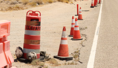 A camera hidden in an orange barrel by the highway