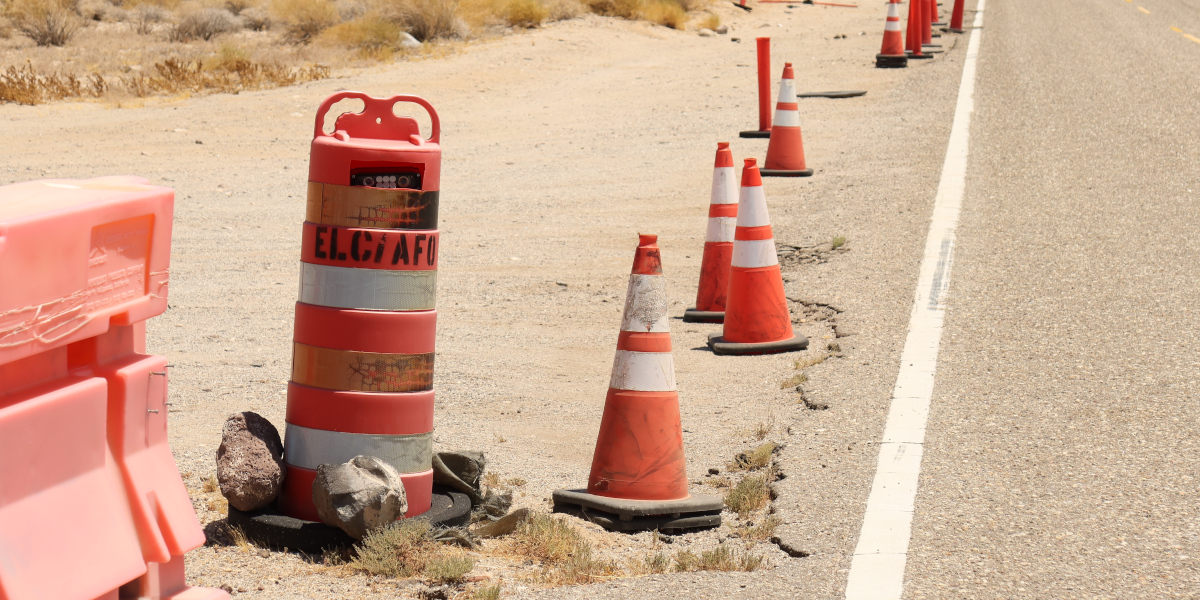 A camera hidden in an orange barrel by the highway