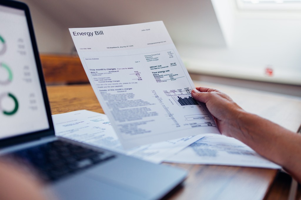 Aerial view of a PG&E electrical substation in San Francisco with the city skyline in the background.