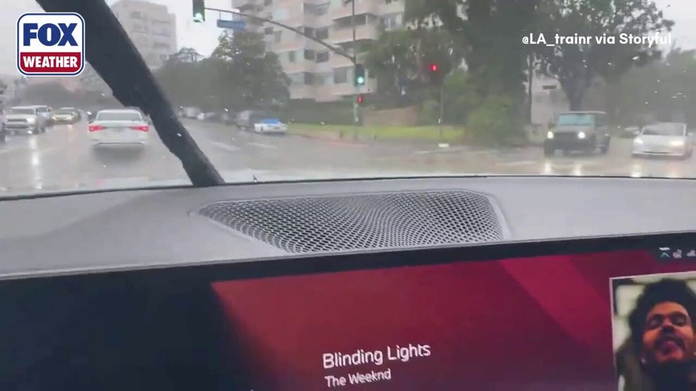 Drivers had to contend with heavy street flooding Los Angeles' Westwood neighborhood on Monday, February 16, 2026, as the first of a series of storms moved over California.  