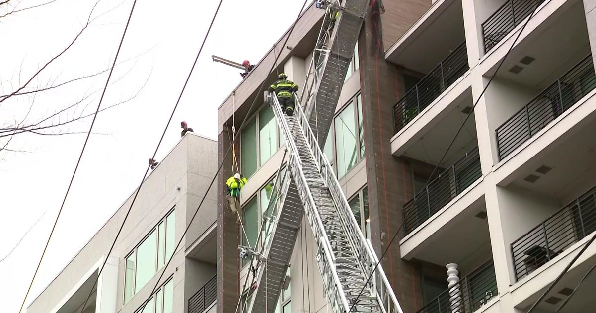 Sacramento firefighters rescuing 2 after scaffolding collapses outside building