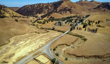 Aerial view of the proposed Sites Reservoir location in Colusa County, Northern California, showing dry rolling hills, ranchland, and roads.