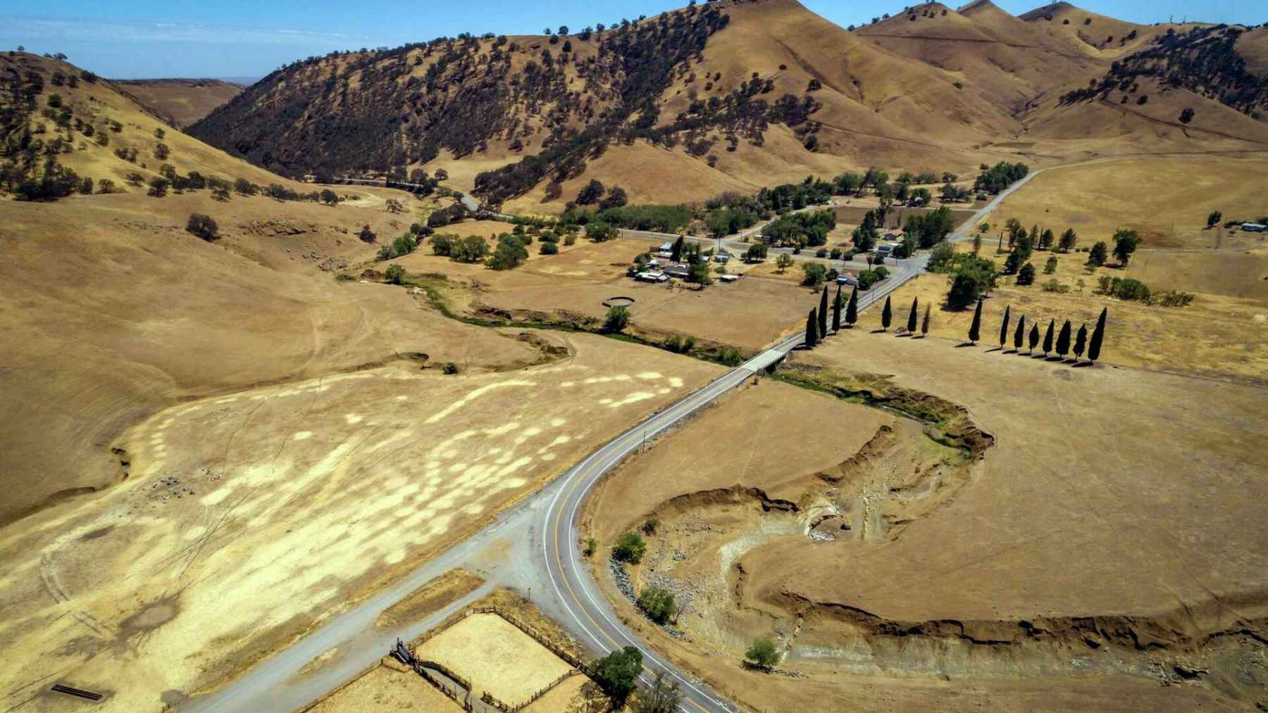 Aerial view of the proposed Sites Reservoir location in Colusa County, Northern California, showing dry rolling hills, ranchland, and roads.