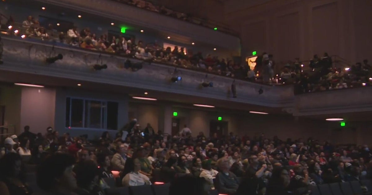 Football fans pack Oakland's Henry J. Kaiser Center for the Arts to watch Super Bowl