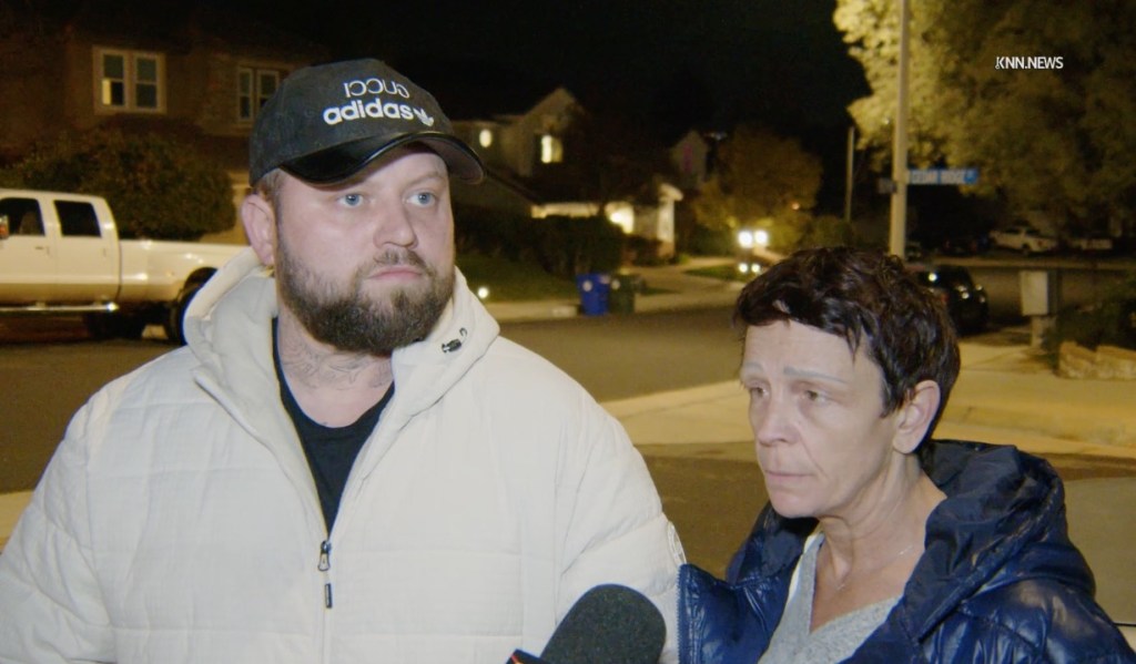 A man and a woman speaking to news reporters at night about their roommate spraying their food with insect repellent.