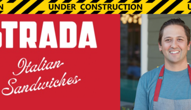 a restaurant sign with caution tape and a man smiling