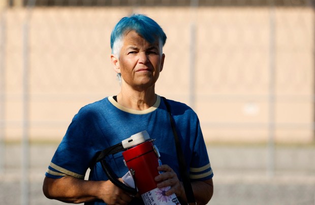 Jeane Wong of the San Diego Bike Brigade looks on during a weekly vigil for people detained at Otay Mesa on Feb. 1, 2026, in San Diego. (K.C. Alfred / The San Diego Union-Tribune)