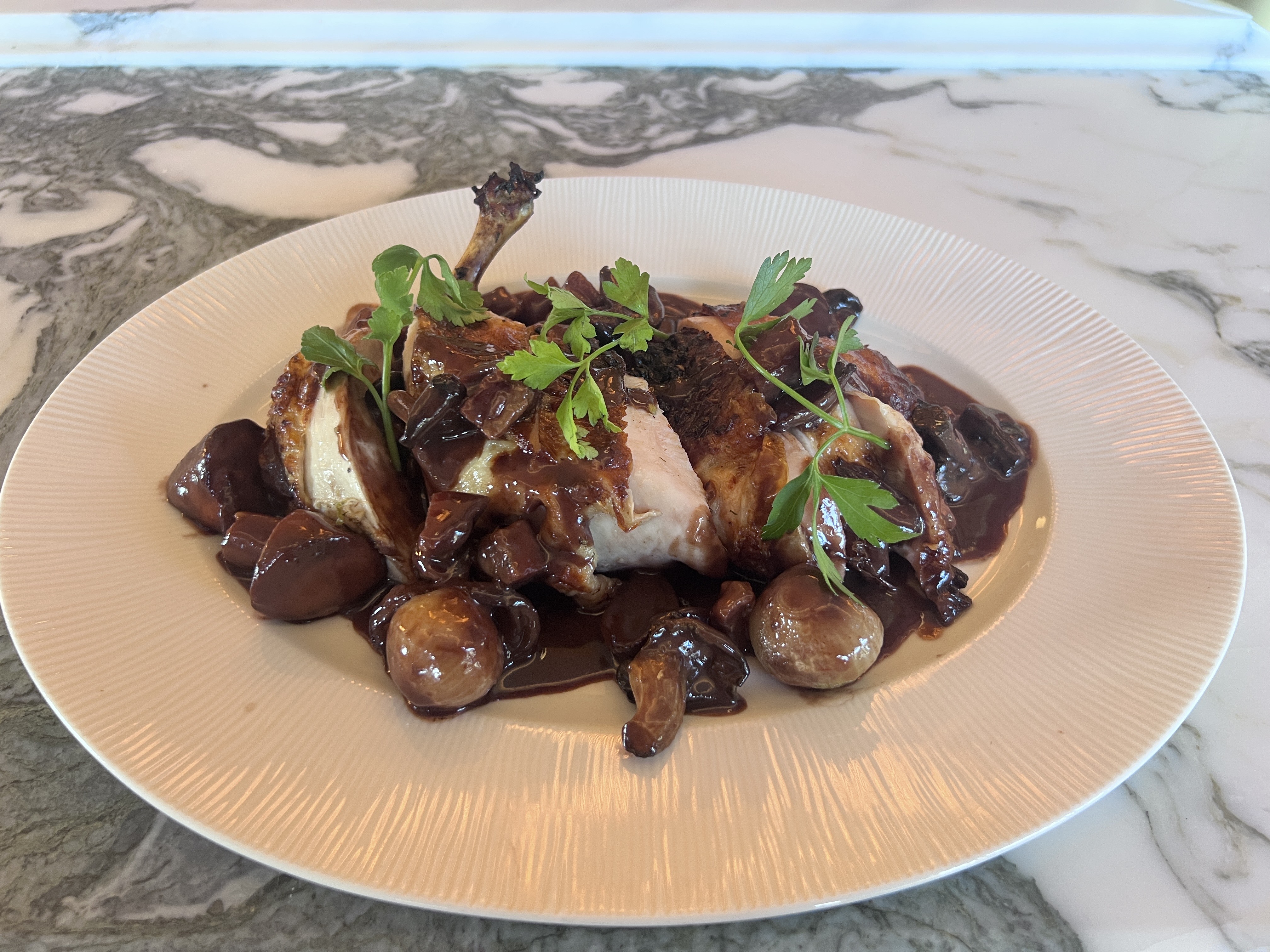 The classic French dish coq au vin is one of...