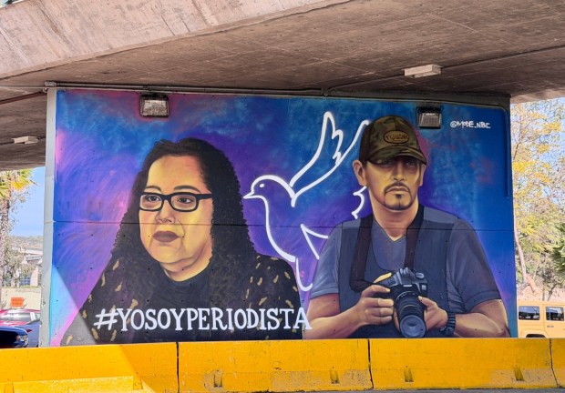 A mural in Tijuana by artist Gerardo "Mode" Orozco honors Lourdes Maldonado and Margarito Martínez, two journalists who were killed in separate shootings outside their homes in January 2022 (Alexandra Mendoza/The San Diego Union-Tribune)