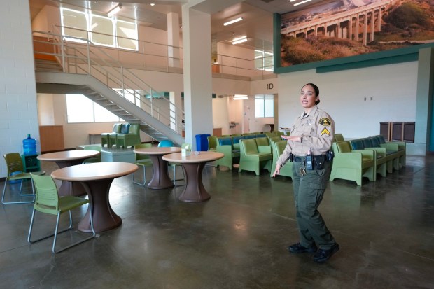 Cpl. Angelic Ordonez leads a tour of one of the open modules at the Las Colinas women's jail on Wednesday, Jan. 28, 2026. (Nelvin C. Cepeda / The San Diego Union-Tribune)