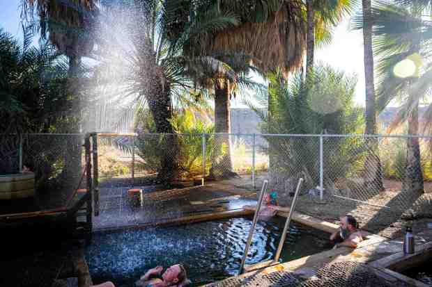People soak in the Old Fogey Hot Springs on Sunday, Feb. 8, 2026 in Holtville, California. (Meg McLaughlin / The San Diego Union-Tribune)