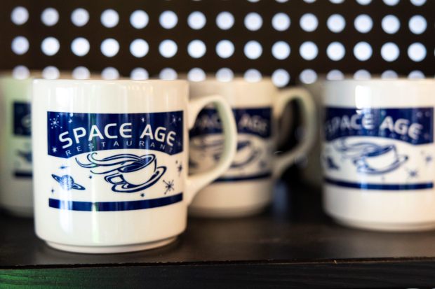 Mugs for sale seen inside the Space Age Restaurant and Bar on Monday, Feb. 9, 2026 in Gila Bend, Ariz.. (Meg McLaughlin / The San Diego Union-Tribune)