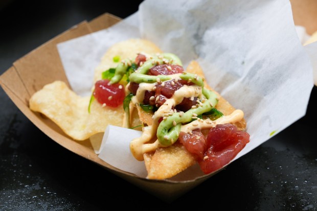 Ahi poke nachos, prepared with ahi marinated in soy sauce, ginger, crushed red pepper, and sesame oil, topped with Sriracha aioli and avocado lime drizzle, and served over seaweed salad, cucumber, and wontons, were among the new items added to the menu at Snapdragon Stadium on Tuesday, Feb. 17, 2026, in San Diego. (Nelvin C. Cepeda / The San Diego Union-Tribune)