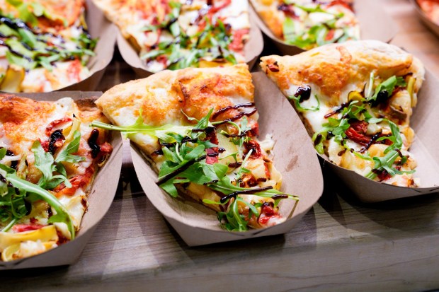 Chefs at Snapdragon created their 12" Augusta (veggie) pizza with San Marzano tomato sauce, mozzarella, roasted garlic, sun-dried tomatoes, arugula, and balsamic reduction. (Nelvin C. Cepeda / The San Diego Union-Tribune)