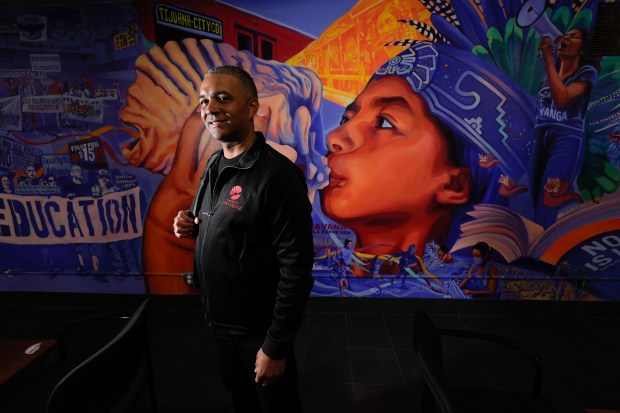 Ricky Shabazz, president of San Diego City College, in front of a campus mural on Tuesday. (Nelvin C. Cepeda / The San Diego Union-Tribune)