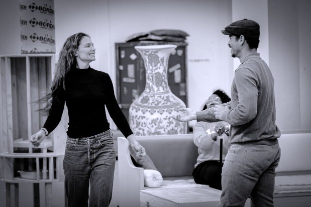 Katie Holmes as Hedda Gabler, left, and Charlie Barnett as George Tesman, with Saidah Arrika Ekulona as Aunt Julie Tesman seated behind them in rehearsal for The Old Globe's production of "Hedda Gabler." (Sandy Huffaker)