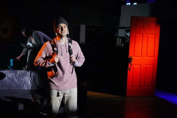 A scene from Trinity Theatre Company's "Rabbit Hole," starring Jordyn Case, rear left, and Paul Bonner. (Megan Goyette)