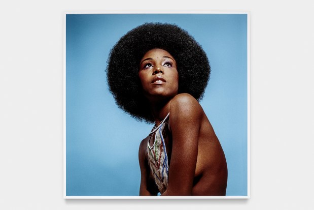 "Untitled (Model Who Embraced Natural Hairstyles at AJASS Photoshoot), circa 1970" by Kwame Brathwait. The Dean Collection, courtesy of Swizz Beatz and Alicia Keys.