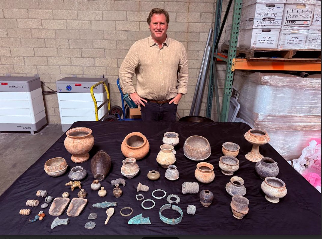 Trevor Murphy and the Thai antiquities before being packed and...