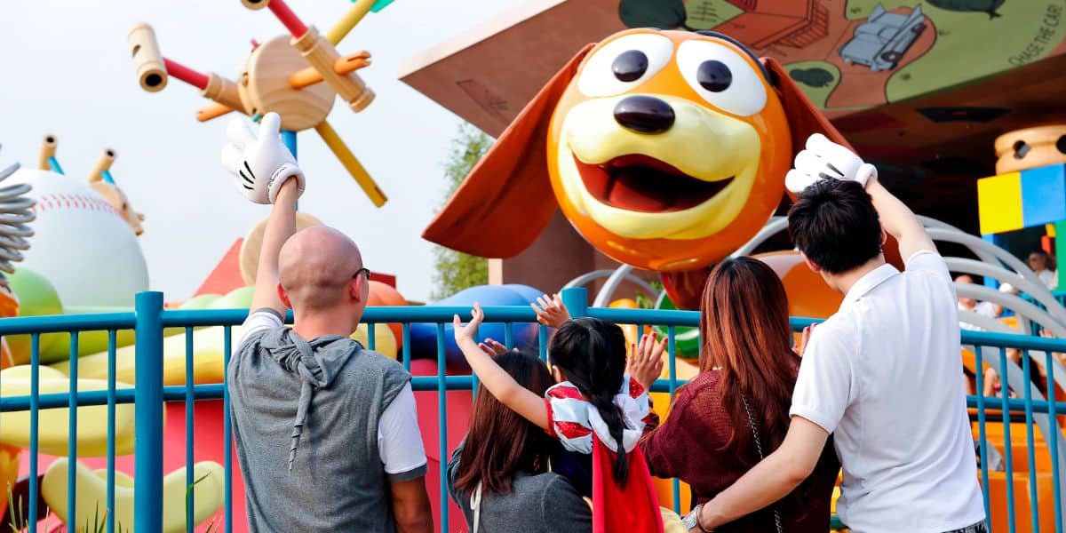 Guests wave at Slinky Dog at Hong Kong Disneyland