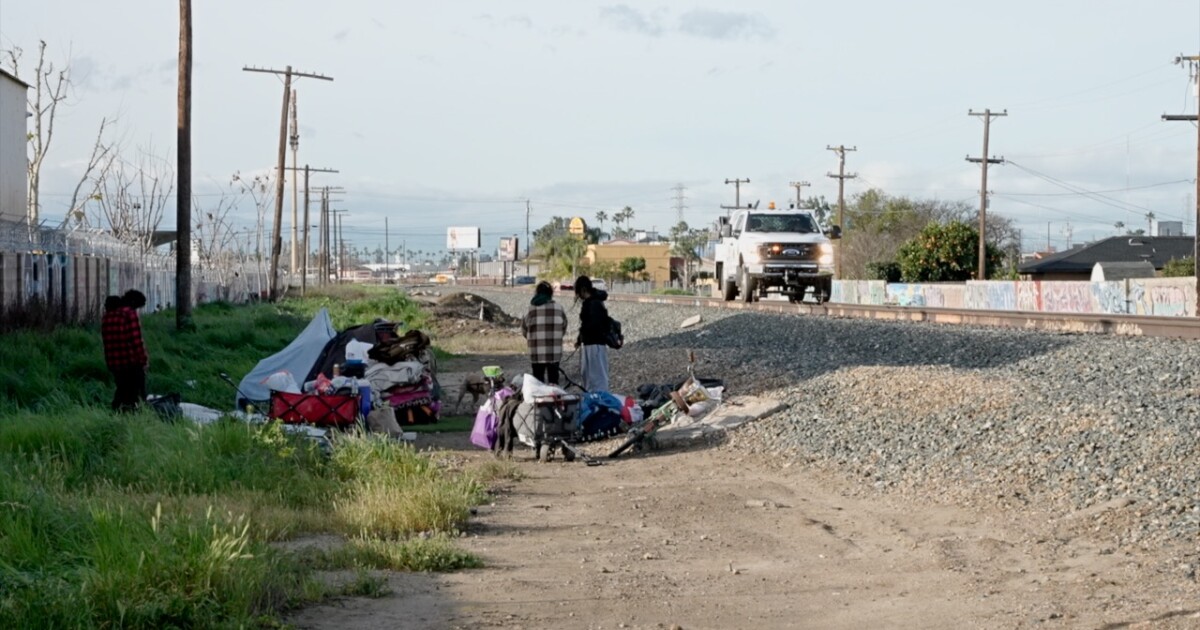 Police clear large railroad encampment, offer resources to displaced residents