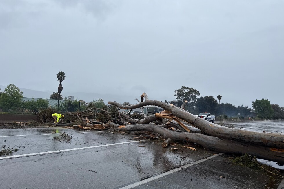 California walloped by winter storm with high winds and heavy rain and snow