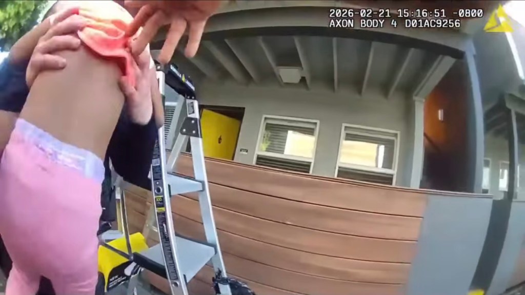 Milpitas police officers rescuing a toddler from a burning apartment building.