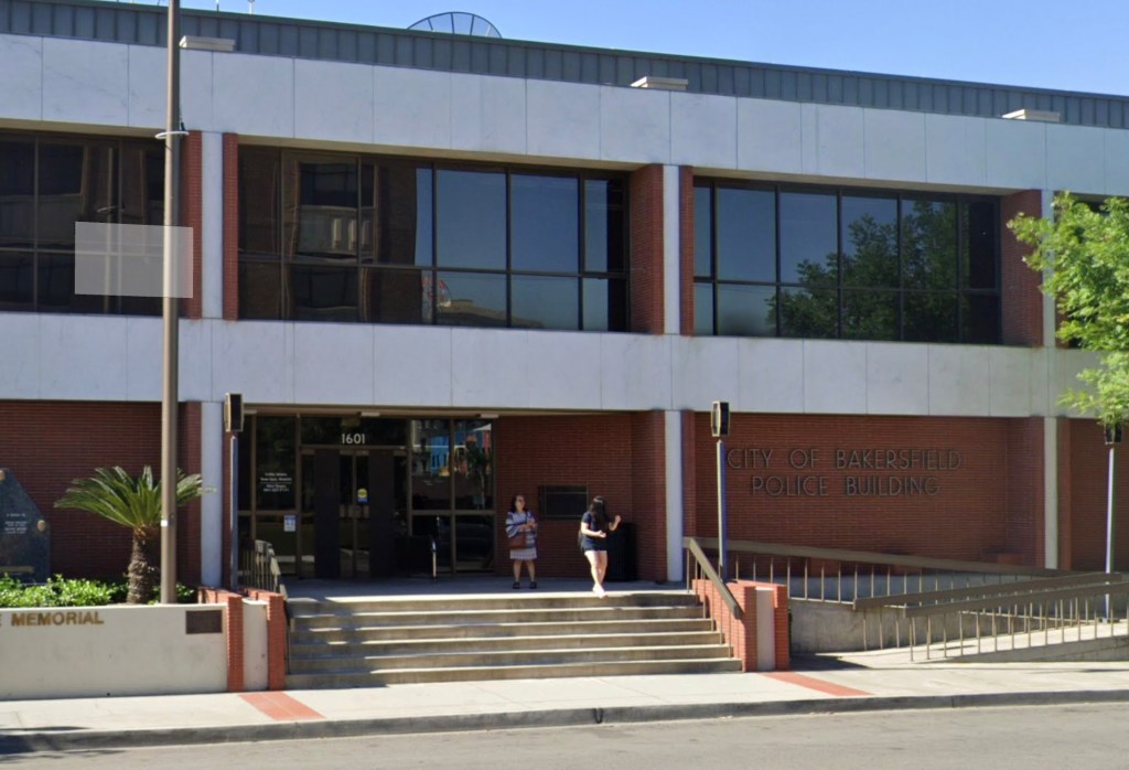 Bakersfield Police Building with two women standing on its front steps.