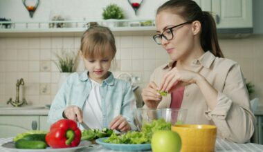 A woman and young girl prepare lunch.