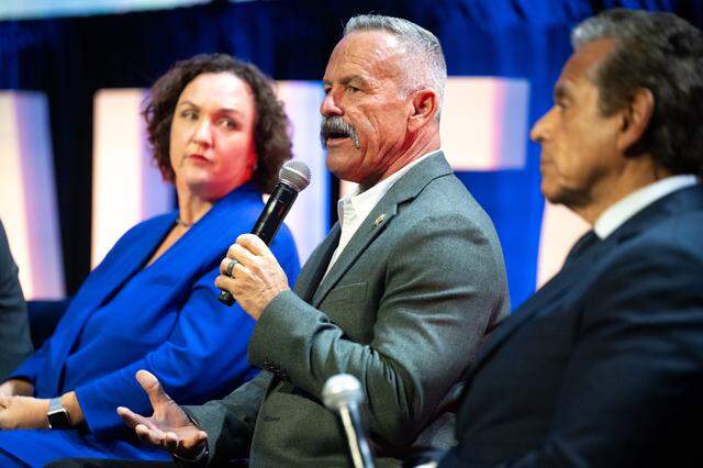 Chad Bianco speaks during a California Chamber of Commerce panel last year in West Sacramento. He has described the state as being on the brink of collapse, and cast himself as its best savior.