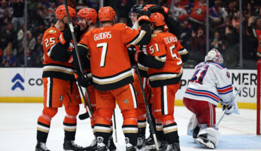 Jan 19, 2026; Anaheim, California, USA;  Anaheim Ducks left wing Jeffrey Viel (second from left) celebrates with Ryan Poehling (25) and Radko Gudas (7) and Olen Zellweger (51) after scoring a goal during the second period against the New York Rangers at Honda Center. Mandatory Credit: Kiyoshi Mio-Imagn Images