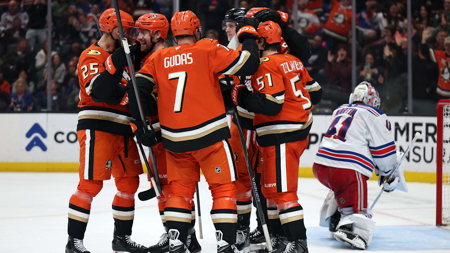 Jan 19, 2026; Anaheim, California, USA;  Anaheim Ducks left wing Jeffrey Viel (second from left) celebrates with Ryan Poehling (25) and Radko Gudas (7) and Olen Zellweger (51) after scoring a goal during the second period against the New York Rangers at Honda Center. Mandatory Credit: Kiyoshi Mio-Imagn Images